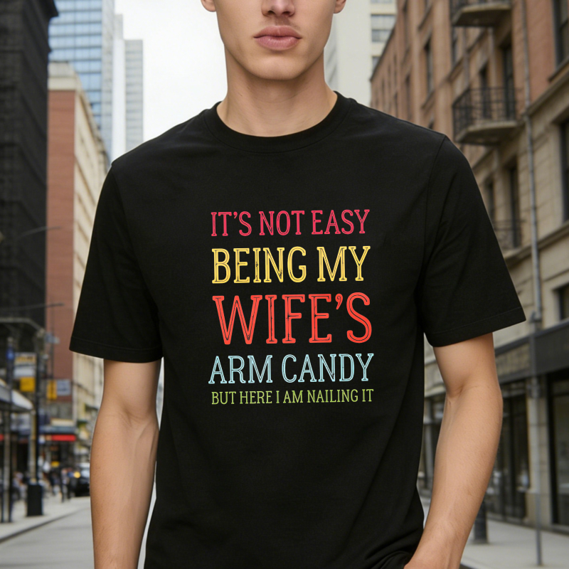Dorawear™ Its Not Easy Being My Wifes Arm Candy But Here I Am Nailing It Unisex Classic T-shirt